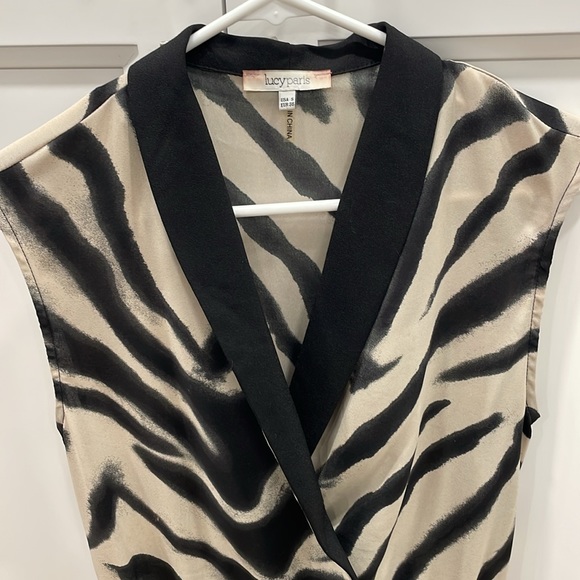 Super cute zebra print romper. Size: S - Picture 2 of 4